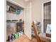 Functional laundry room equipped with washer, dryer, and shelving for storage at 125 Russell Rd, Lawrenceville, GA 30043