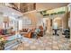 Spacious living area with high ceilings, open floorplan, tile flooring and access to dining at 125 Russell Rd, Lawrenceville, GA 30043