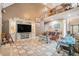 Comfortable living room boasts an entertainment center, tile floor, and multiple seating areas at 125 Russell Rd, Lawrenceville, GA 30043
