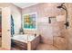 Serene main bathroom featuring a luxurious soaking tub and separate shower at 125 Russell Rd, Lawrenceville, GA 30043