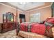 Spacious main bedroom offering a large dresser, television, and access to the outdoors at 125 Russell Rd, Lawrenceville, GA 30043