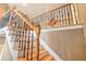 Elegant staircase featuring decorative iron railings and wooden steps at 125 Russell Rd, Lawrenceville, GA 30043