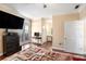 Spacious bedroom featuring hard wood floors, TV, desk, and access to bathroom and walk-in closet at 2161 Peachtree Ne Rd # 402, Atlanta, GA 30309