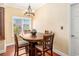 Bright dining room featuring hardwood floors, a modern light fixture and window views at 2161 Peachtree Ne Rd # 402, Atlanta, GA 30309