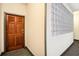 Hallway featuring a wood door and decorative glass block accent at 2161 Peachtree Ne Rd # 402, Atlanta, GA 30309