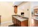 Kitchen featuring stainless steel sink, granite countertops, and wooden cabinets for a modern and functional space at 2161 Peachtree Ne Rd # 402, Atlanta, GA 30309