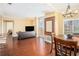 Living room featuring hardwood floors, balcony access and a dining area at 2161 Peachtree Ne Rd # 402, Atlanta, GA 30309
