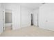 This bedroom features neutral colored carpet and access to the bathroom at 2832 Evanshire Ave # 112, Duluth, GA 30096