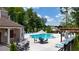 Inviting community pool area with lounge chairs, umbrellas, and outdoor seating at 2832 Evanshire Ave # 112, Duluth, GA 30096