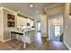 Charming kitchen with white cabinets, stainless appliances, and breakfast bar seating at 2832 Evanshire Ave # 112, Duluth, GA 30096