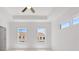 Bright main bedroom featuring a tray ceiling and two large windows at 2832 Evanshire Ave # 112, Duluth, GA 30096