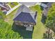 Aerial view of a backyard with a concrete patio and lush green lawn at 4066 Wild Orchid Ln, Loganville, GA 30052