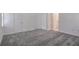 Spacious bedroom with plush carpet, bright white walls, and an attached bathroom at 4066 Wild Orchid Ln, Loganville, GA 30052