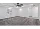 A bedroom with a ceiling fan, recessed lights, crown molding, carpet flooring, and two doorways at 4066 Wild Orchid Ln, Loganville, GA 30052