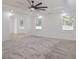 A bedroom with a ceiling fan, recessed lights, carpet flooring, crown molding, and 3 large windows at 4066 Wild Orchid Ln, Loganville, GA 30052