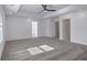 Bright primary bedroom with neutral walls, gray carpet, and walk-in closet access at 4066 Wild Orchid Ln, Loganville, GA 30052