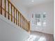 Staircase featuring wood railing and tile flooring at 4066 Wild Orchid Ln, Loganville, GA 30052
