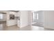 Bright, white kitchen featuring a breakfast bar and stainless steel appliances at 4066 Wild Orchid Ln, Loganville, GA 30052