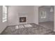 Cozy living room with a fireplace, carpet, and neutral paint at 4066 Wild Orchid Ln, Loganville, GA 30052