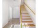 Staircase featuring wood railing and tile flooring at 4066 Wild Orchid Ln, Loganville, GA 30052