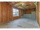 Unfinished basement featuring concrete floor, insulated ceiling and one window at 4437 James Wade Dr, Snellville, GA 30039