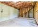 Unfinished basement featuring concrete walls, insulation and concrete floor at 4437 James Wade Dr, Snellville, GA 30039