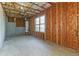 Basement with unfinished walls, insulation and concrete flooring at 4437 James Wade Dr, Snellville, GA 30039