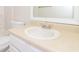 Bathroom features a white sink, mirror, and toilet at 4437 James Wade Dr, Snellville, GA 30039