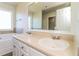 Bathroom featuring a double vanity, large mirror, soaking tub, and neutral colors for a serene atmosphere at 4437 James Wade Dr, Snellville, GA 30039