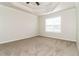 Bedroom features neutral carpet, natural lighting and tray ceiling at 4437 James Wade Dr, Snellville, GA 30039