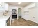 Bright kitchen featuring stainless steel appliances, sleek countertops, and white cabinets for a modern touch at 4437 James Wade Dr, Snellville, GA 30039