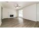 Spacious living room with hardwood floors and a beautiful fireplace at 4437 James Wade Dr, Snellville, GA 30039