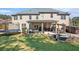 Expansive backyard with patio, hot tub, trampoline, and seating area perfect for entertaining at 4922 Summer Wind Dr, Buford, GA 30519