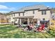 Wide view of the back yard with entertainment features and fire pit at 4922 Summer Wind Dr, Buford, GA 30519