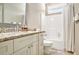 Bright bathroom featuring granite countertops, a tub-shower combo, and neutral tones for a clean, modern design at 4922 Summer Wind Dr, Buford, GA 30519