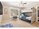 bedroom with bunk bed, ceiling fan, carpet, and natural light at 4922 Summer Wind Dr, Buford, GA 30519