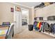 Neutral bedroom features a desk, closet space, and bunkbeds across from the hall at 4922 Summer Wind Dr, Buford, GA 30519