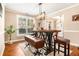 Dining room with modern table and seating with a view of the entryway at 4922 Summer Wind Dr, Buford, GA 30519
