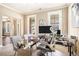 This home office features a large window, neutral paint, and is furnished with a chrome desk at 4922 Summer Wind Dr, Buford, GA 30519