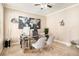 This home office features neutral paint, and is furnished with a chrome desk, and grey office chairs at 4922 Summer Wind Dr, Buford, GA 30519