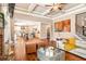 Elegant living room with coffered ceilings, hardwood floors, and an open view to the kitchen at 4922 Summer Wind Dr, Buford, GA 30519