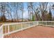 Wood deck overlooks the spacious backyard with mature trees at 5700 Tracy Dr, Mableton, GA 30126
