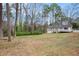 Spacious backyard with mature trees at 5700 Tracy Dr, Mableton, GA 30126