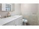 Modern bathroom with new vanity, stylish fixtures, and decorative tile at 5700 Tracy Dr, Mableton, GA 30126