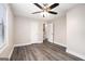 Bright bedroom features hardwood floors and a ceiling fan at 5700 Tracy Dr, Mableton, GA 30126