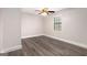 Clean bright bedroom features modern gray wood floors and bright natural light at 5700 Tracy Dr, Mableton, GA 30126