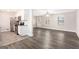 Open-concept living space showcasing new wood floors, natural light, and an adjacent updated kitchen at 5700 Tracy Dr, Mableton, GA 30126