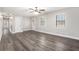 Open living area featuring modern floors, neutral paint, windows and updated lighting at 5700 Tracy Dr, Mableton, GA 30126