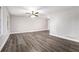 Spacious living room with hardwood flooring, neutral paint and abundant natural light at 5700 Tracy Dr, Mableton, GA 30126