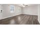 Bright living room with modern hardwood floors, fresh neutral paint, and many windows at 5700 Tracy Dr, Mableton, GA 30126